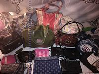 Overview of all handbags, totes and small purses laid out