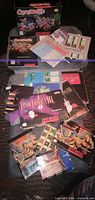 All five SNES game boxes, manuals, maps and inserts laid out