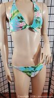 Mannequin modeling blue floral bikini top and bottom