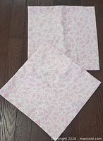 Both cushion covers laid flat showing full size and pattern