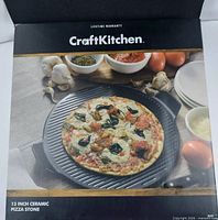 Retail box showing Craft Kitchen 13" Ceramic Pizza Stone