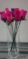 Bundle of 12 wooden roses in glass vase
