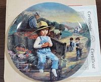 Front of decorative plate showing artwork and signature