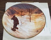 Front of plate showing artwork and gold rim