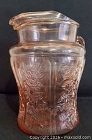 Front view of pink Sharon Cabbage Rose depression glass pitcher