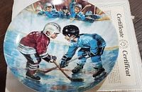 Front view of plate displaying hockey scene