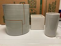 All three pottery pieces side by side