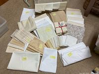 Grouped light neutral cotton fabrics with yardage notes visible