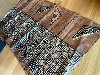 Full view of folded tapa cloth showing patterns