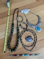 All seven jewelry pieces laid out for overview