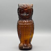 Front view of amber owl decanter assembled