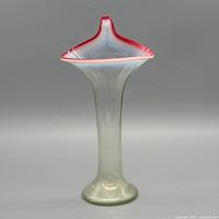 Full view of vase front showing cranberry rim and iridescent body