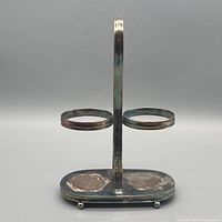 Front view showing two rings, stem, base and tarnish