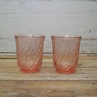 Front view of both pink swirl tumblers