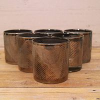 Front view of six smoky gray chevron tumblers grouped together