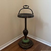 Full view of smoking stand against wall