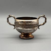 Front view of Viking Plate silver-plated two-handled sugar bowl showing overall form and tarnish