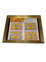 Front view of framed promotional stamp sheet