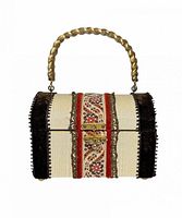 Front view showing cream fabric body, embroidered ribbon, gold-tone handle and clasp