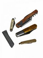 Group shot of all five folding cutters, showing overall condition and size differences