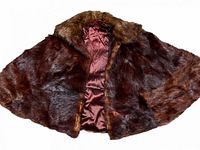 Full view of brown fur cape opened to show satin lining