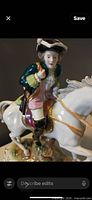 Close view of rider detail on porcelain figurine