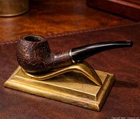 Stand holding a pipe to illustrate use; shows overall form and size.