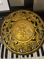 Front view showing full carved panel and details