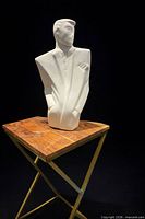 front view of ceramic bust on stand