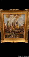 Frontal view of signed oil painting in ornate gold frame