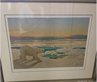 Framed print showing polar bear scene, matting and frame visible