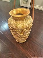 full view showing entire gold gilded ceramic vase