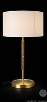 Full view of brass and wood table lamp with shade