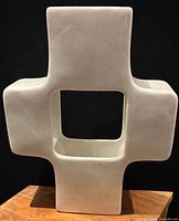 Front view showing cross shape and square aperture