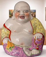 Front view of hand-painted porcelain Laughing Buddha