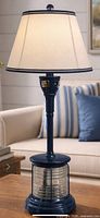 full view of navy blue Pottery Barn lamp base with shade shown for scale