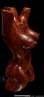Front three-quarter view of wooden female torso sculpture