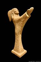 Full view of signed terracotta figural sculpture on black background