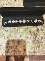 Full view of sterling silver nautical motif bracelet in display box