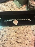Bracelet displayed in open black presentation case