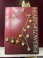 Booklet titled "Hearts & Flowers" by Joan Rivers on tabletop