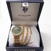 Set in open presentation box showing watch and two bracelets