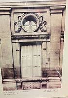 Close view of print showing architectural detail and artist text