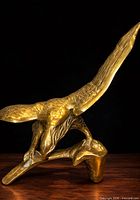 Full view brass eagle sculpture front left