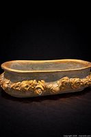 Full view of oval planter showing rose garland and gold detailing