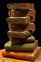 Full view of stacked books wooden sculpture front angle