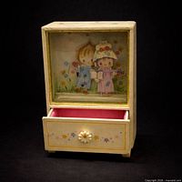 Front view showing illustration, drawer open