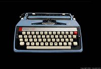 Front view of Webster XL-600 typewriter showing full keyboard and brand label