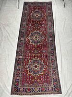 Full view of entire Tabriz runner rug on white backdrop