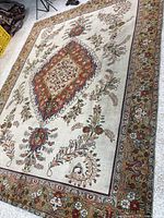 Full view of the Tabriz rug showing overall design and size